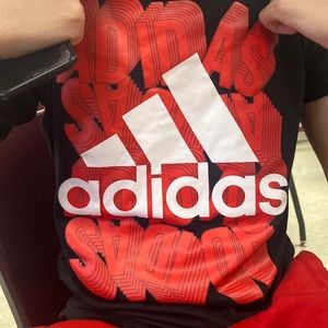 Black , red and white adidas’s shirt